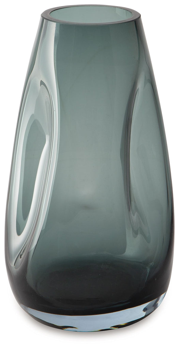 Sleek. Contemporary. Chic. This vase has an organic sense of movement, recalling seaside aesthetics with its teal glass. A stunning solo accent, it also acts as a beautiful vessel for florals and other decorative fillers. And the vase is safe for outdoor 
