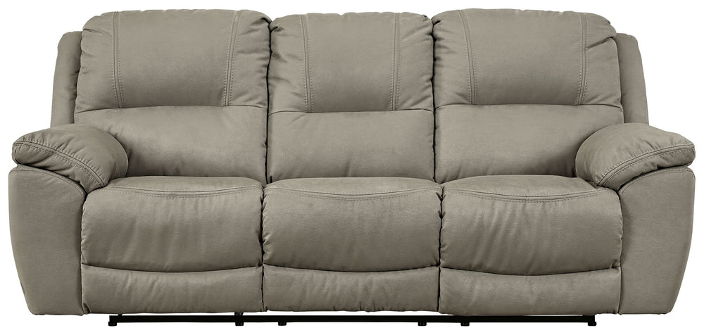 Kick back, relax, and enjoy some sports on TV with this reclining sofa. You will love its double stuffed pillow top arms and soft-as-suede faux leather upholstery. The family-friendly dark gray color and creative stitching add panache. Recline in comfort 
