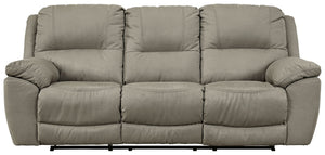 Kick back, relax, and enjoy some sports on TV with this reclining sofa. You will love its double stuffed pillow top arms and soft-as-suede faux leather upholstery. The family-friendly dark gray color and creative stitching add panache. Recline in comfort 