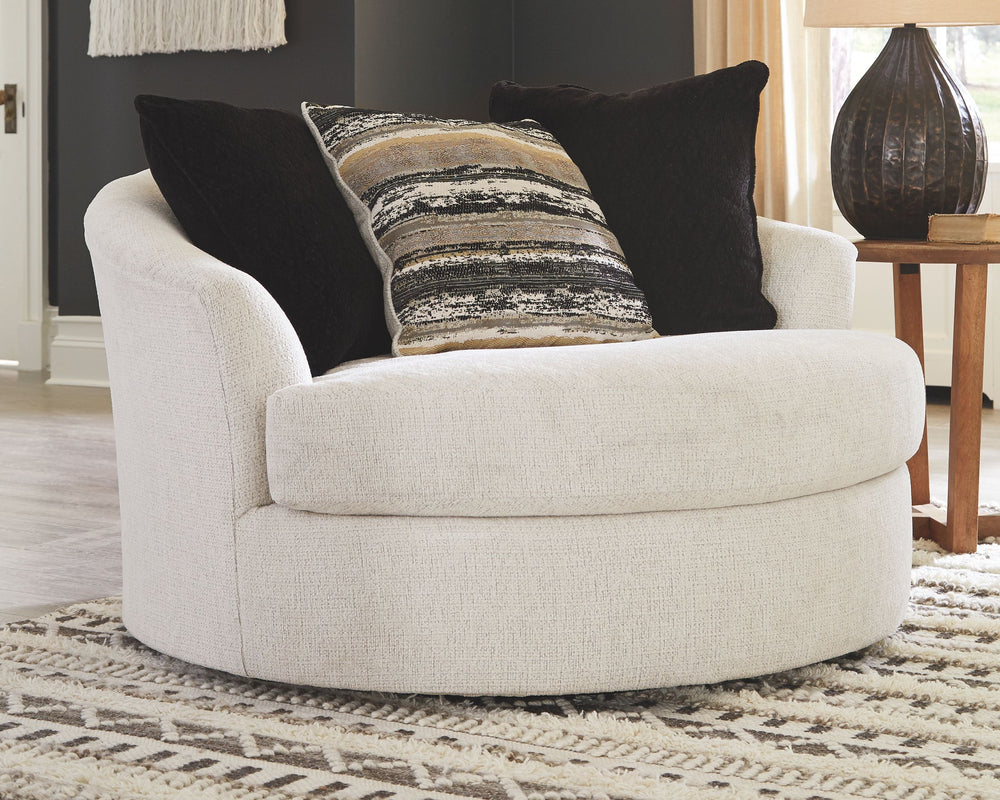Let it snow. Doubling your pleasure with a spacious seating area with room for twoâ€”or just youâ€”this oversized round swivel chair in a snow-tone neutral invites you to stretch your style in an easy-elegant way. Whether your aesthetic is urban hip or su