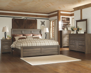 Vintage aged brown rough sawn finish over replicated oak grain. Large scaled rustic bedroom collection features case pilasters and thick poster bed posts. Substantial warm pewter color drawer handles. Poster bed offers optional footboard storage. Side rol