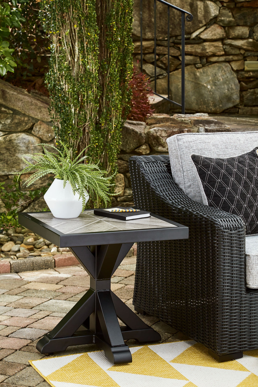 Sporting an easy-on-the-eyes elegance, this end table elevates the art of alfresco living. Beautiful and durable enough for indoor and outdoor use, this high-style/low-maintenance table charms with X-leg farmhouse styling. With a unique reverse diamond ti
