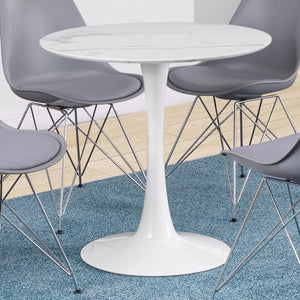  this round dining table brings timeless elegance to any space. The smooth faux marble top offers a refined aesthetic while providing easy maintenance with a durable polyurethane sealer. A sleek tulip base enhances i