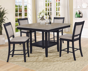 Introduce a touch of contemporary sophistication to your dining area with this stunning counter height dining set. The centerpiece table boasts a chic, two-tone finish with a sleek, dark base and a beautifully textured gray tabletop with built-in turntabl