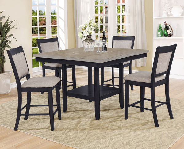Introduce a touch of contemporary sophistication to your dining area with this stunning counter height dining set. The centerpiece table boasts a chic, two-tone finish with a sleek, dark base and a beautifully textured gray tabletop with built-in turntabl