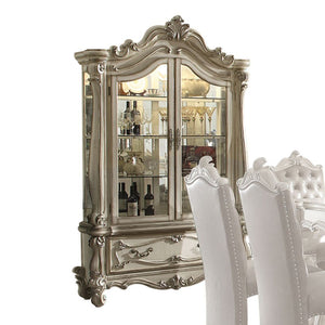 Curio Cabinet Arched Top: Touch Light & 2 Glass Doors (3 Glass Shelves & Back Mirror Inside) Base: 1 Drw Oversized Scrolled Trim, Leaf Crown and Post-Leg (Poly Resin with Antique Contrast Finish) Drawer: GLIDE Side Metal, DT French, Felt-Lined Included<br