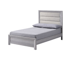 This bedroom set is the embodiment of understated sophistication, featuring a neutral drift wood finish that complements its clean and contemporary design. The robust bed frame anchors the room with a sense of sturdiness and style. Accompanying the bed ar