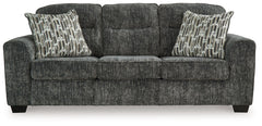 This sofa speaks to those drawn to fresh, contemporary style with richly neutral appeal. Subtle and sophisticated, the plush upholstery and dark tri-block legs are a natural complement for so many color schemes. Two accent pillows make the seating even mo