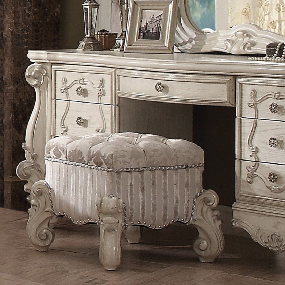 The Versailles vanity stool is the perfect accent to create the style of royalty your bedroom has been needing. This vanity stool crafted in wood with bone white finish was inspired by old European design with an upholstered tight seat cushion with welted