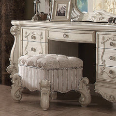 The Versailles vanity stool is the perfect accent to create the style of royalty your bedroom has been needing. This vanity stool crafted in wood with bone white finish was inspired by old European design with an upholstered tight seat cushion with welted