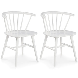 Bring light to your dining area with clean lines and a bright, white finish. The dining room chair sports a low spindle back with turned legs for beautiful simplicity. This functional piece marries minimalism with big style for a delightful combination.<b