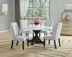 A fresh take on a traditional silhouette makes this group a great addition to your dining space. A genuine marble top is luxurious and timeless. Farmhouse style cross legs are updated in a contemporary charcoal finish. The upholstered dining chairs featur
