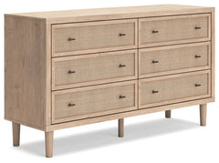 Clean-lined and contemporaryâ€”but far from starkâ€”this dresser is a fresh style awakening. Pairing a light finish with replicated oak grain and textured beige details that replicate the look of cane, its mixed materials bring a naturally versatile vibe 