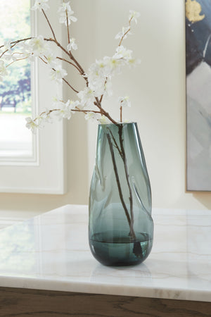  recalling seaside aesthetics with its teal glass. A stunning solo accent