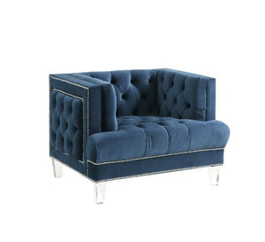 Sophistication meets modern with the Ansario living room collection. The rich blue velvet adds character to any room. Showcasing a square back, high arms, and nail-head trim, feature button tufted accents. The acrylic legs give off a modern vibe to the pi