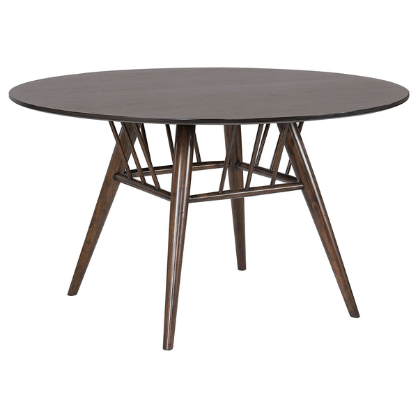 A charming basket detail adds to the mid-century charm of a round dining table. The wood table features a sap walnut veneer tabletop with a deep, rich walnut wood finish, creating a refined touch in your kitchen or dining room. Underneath, flared legs fea