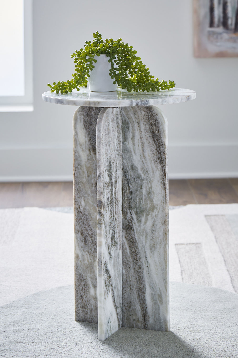 Style to aspire to. This accent table appeals to your eye for artisanal design at an affordable price. The all-marble construction makes it a sculptural addition to your curated space. Whether this table is standing alone or with decor on its smooth top, 