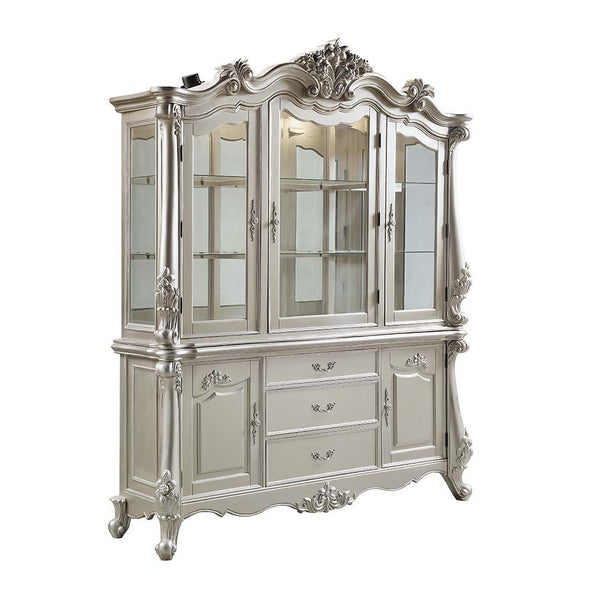 the Devayne dining table brings in all the allure and charm that you are seeking for a dining table. The table features an extension leaf that allows for additional dinner guests. The champagne finish enhances the beautiful 