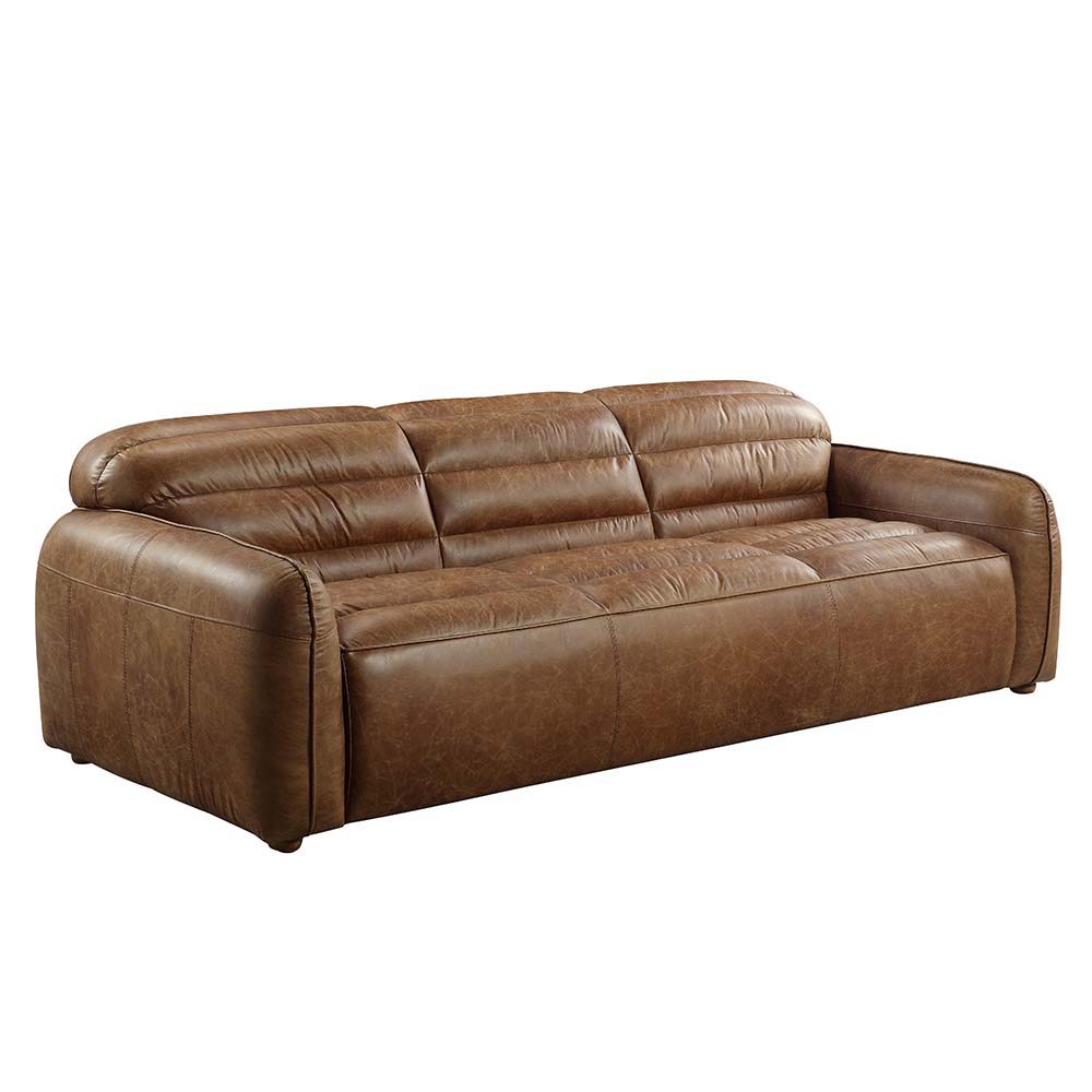 The allure of the Rafer sofa lies in details like piped seams, full foam seat cushions, and Cocoa top grain leather upholstery. These are balanced with an inviting profile, creating a piece that fits perfectly in a casual apartment as it does a formal liv