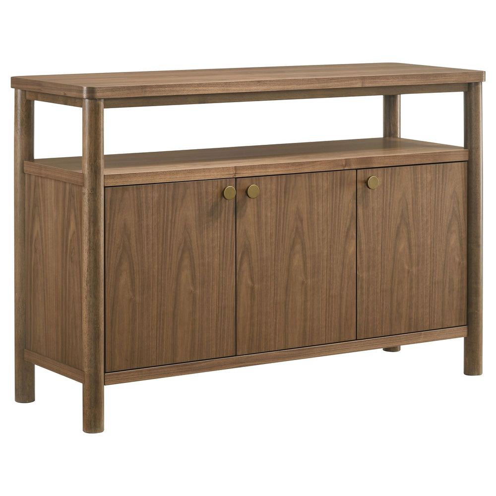 Add easy style and ample storage to your dining room with a modern wooden sideboard with three doors. An open shelf adds easy display space beneath the tabletop, perfect for seasonal accessories that enhance a personalized look and feel. The sideboard fea