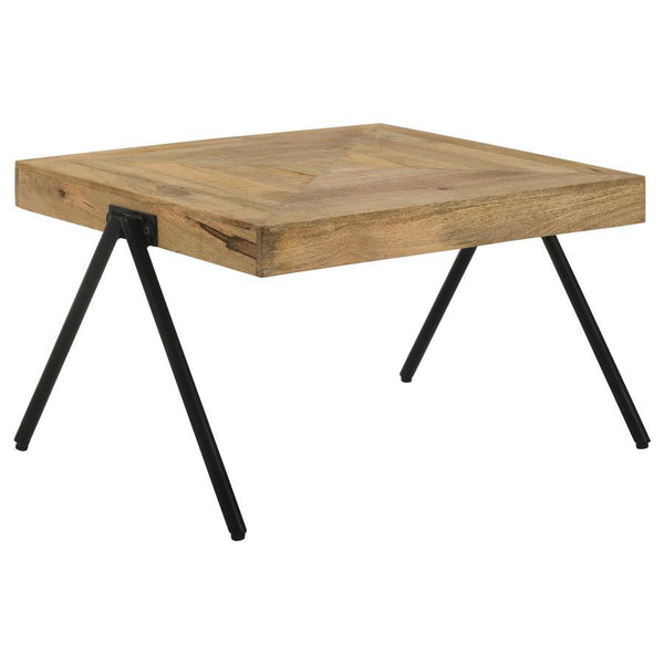 Enhance your living space with this rectangular coffee table, crafted from solid mango wood and finished in a natural tone to highlight its unique grain patterns. Its sturdy iron legs, coated in a sleek black powder finish, offer lasting durability and a 