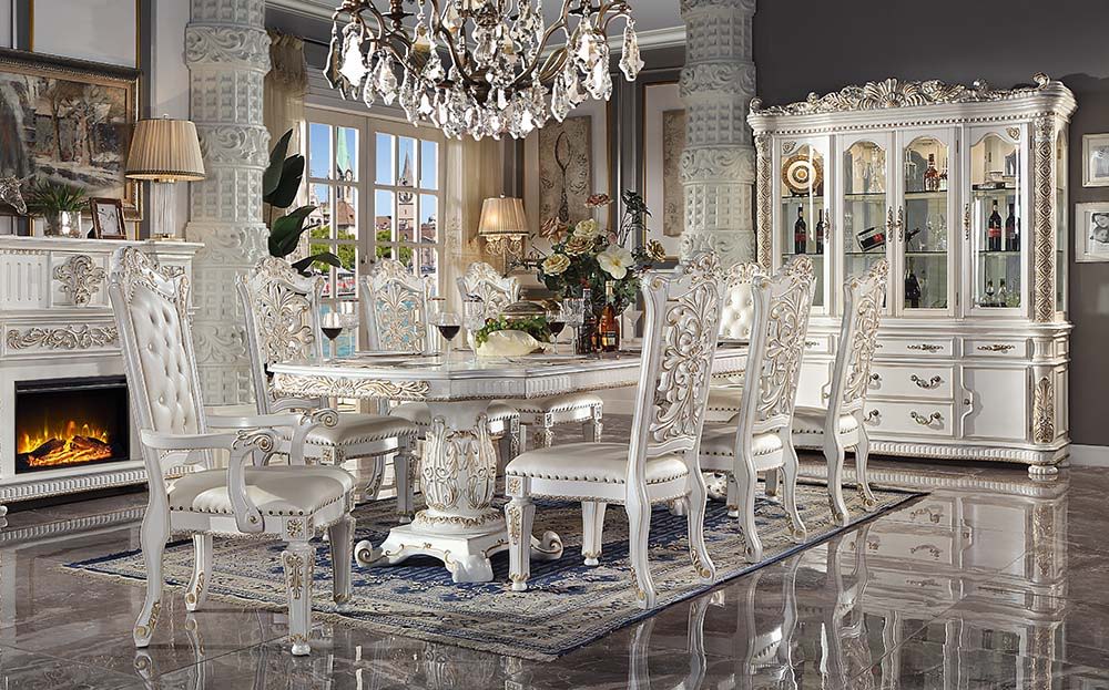 Commanding attention in any space, the impressive design of the Vendom double pedestal dining table will impress everyone. Adorned with classic elements including scrolls, curved shapes, and leaf molding accents to create an old-world charm. The antique p