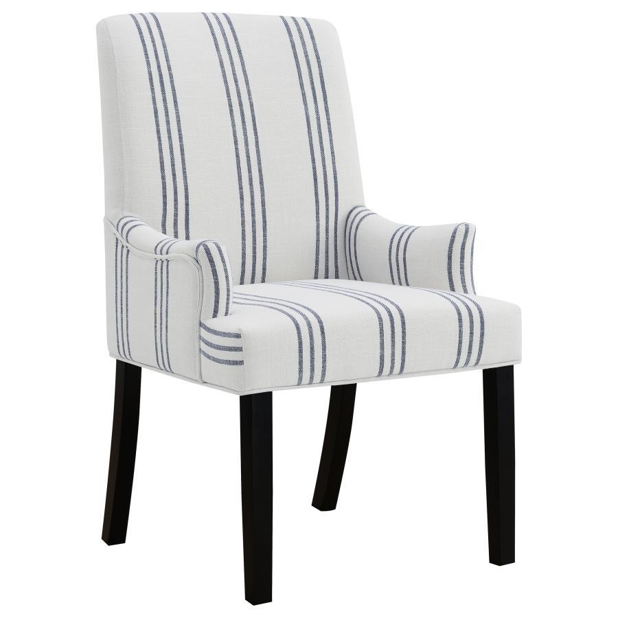 This armchair adds a refined yet relaxed charm to your dining space, blending comfort with casual elegance. Upholstered in linen-like beige fabric with blue stripes, it offers a timeless aesthetic. The padded seat, backrest, and gracefully curved arms ens