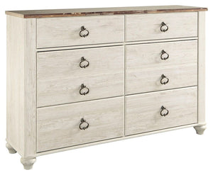 This dresser is the ultimate statement piece for your coastal cottage or shabby chic inspired retreat. A whitewash finish on the drawers and sides is wonderfully easy on the eyes. Paired with the unique plank-effect top, itâ€™s a driftwoody look that has 