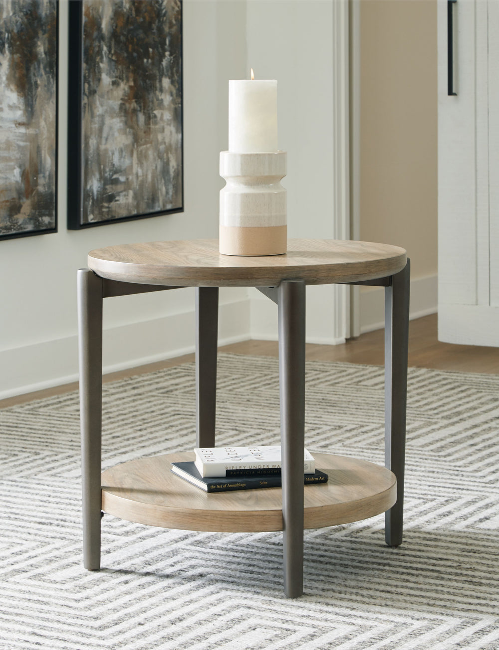 Merging industrial and contemporary elements, this end table turns display space into an art form. The whitish brown wood-tone finish is right on trend, while contrasting painted metallic legs offer a modern touch of stripped-back beauty. With its streaml