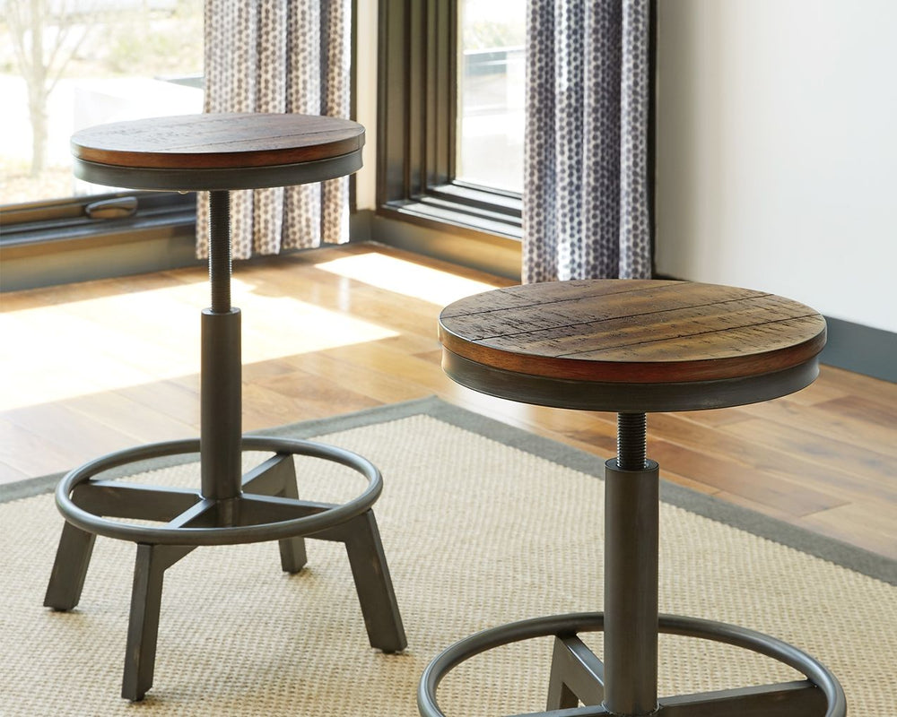 Make your home the hub for cool vibes with this stool. Two-tone finish scheme of distressed warm brown and aged gunmetal is full of urban industrial swagger. Adjustable height is accommodating for you and your guests. Add it behind your sofa with a long c