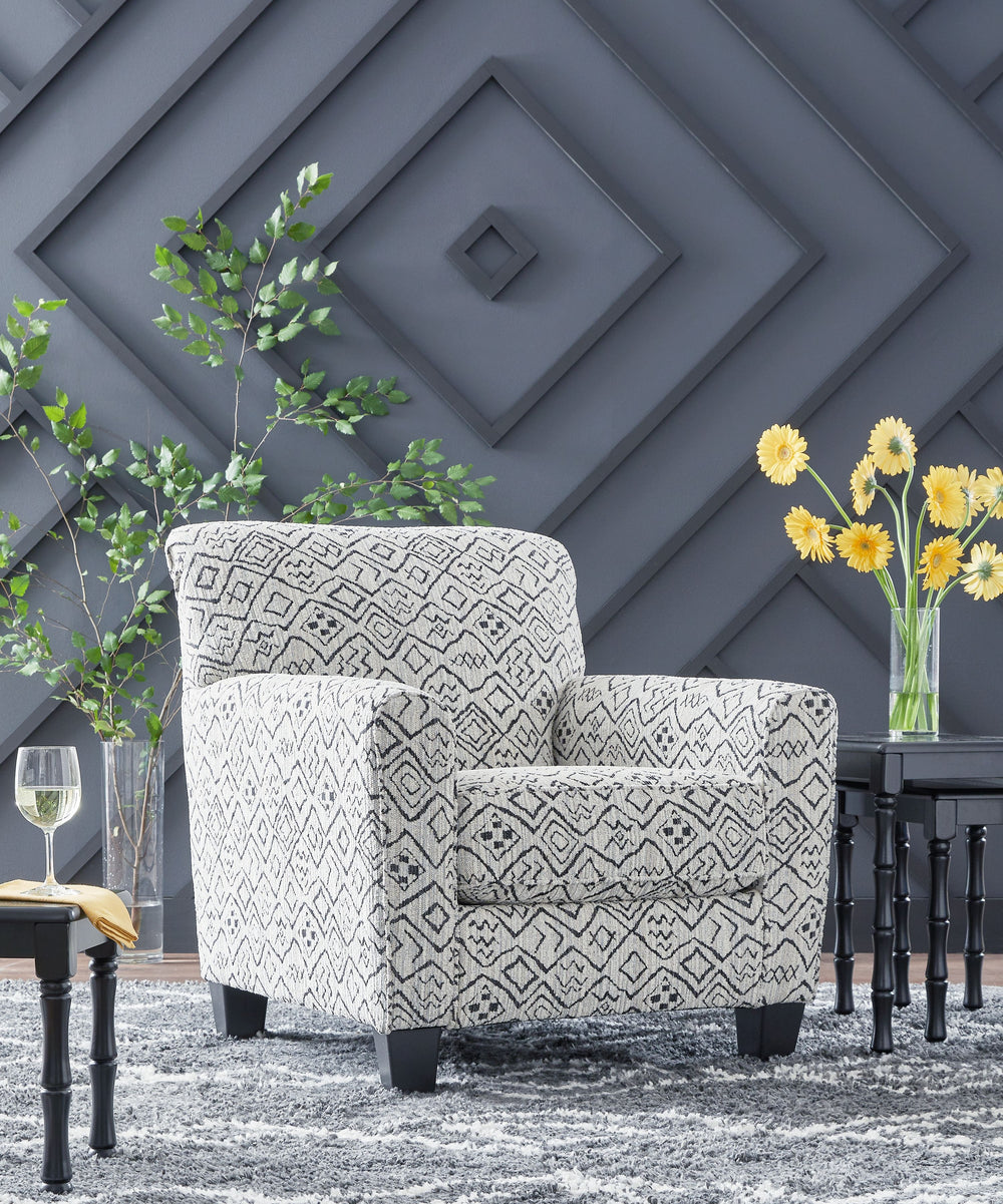 Add visual variation to your contemporary hideaway. This accent chair caps off your aesthetic with a welcome pop of pattern. In neutral hues, the eye-catching piece stays versatile enough to pair with existing seating. Stage it with another chair to creat