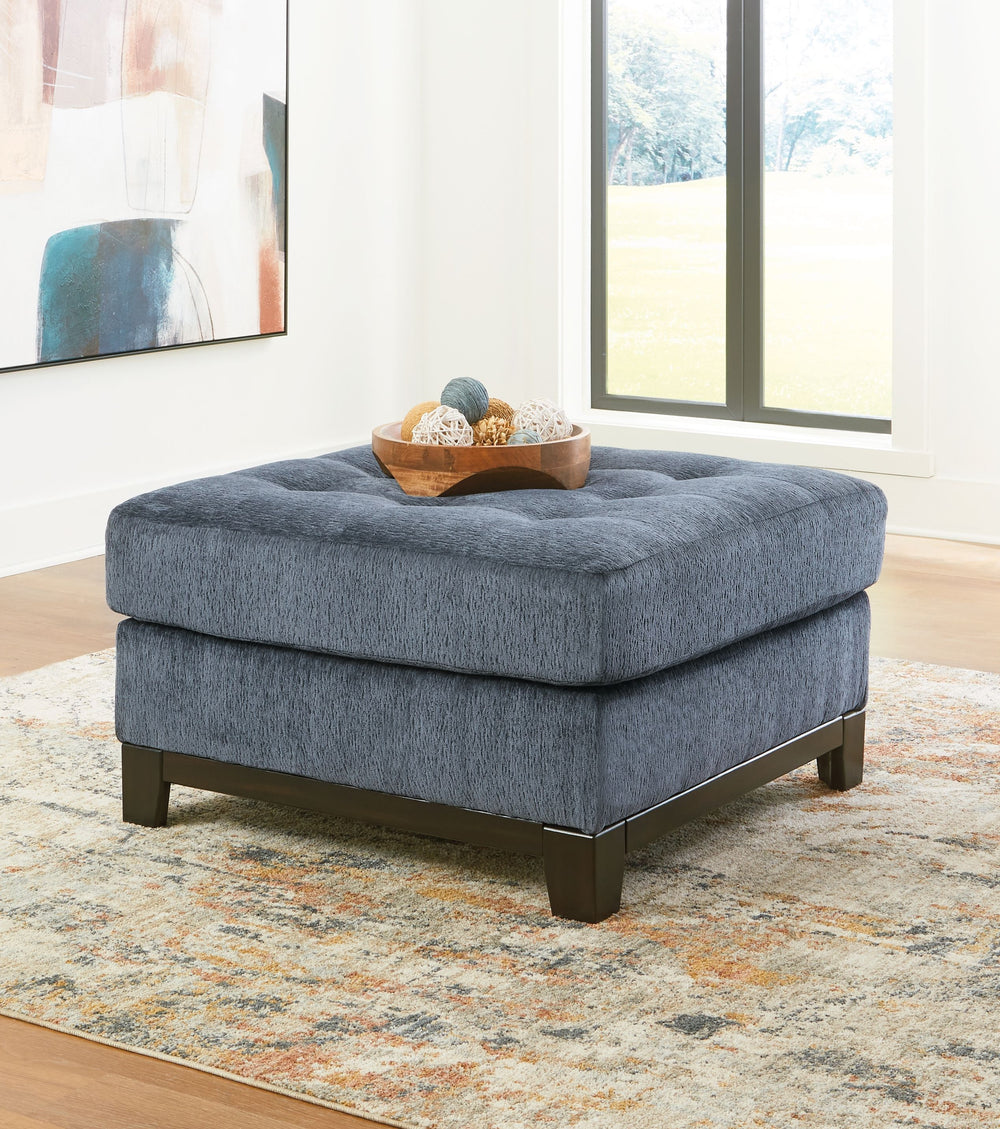 Fresh, on-trend style meets functionality in this oversized accent ottoman. Details like a tufted top cushion and wrap-around accent base reflect your urban contemporary tastes while staying versatile as your style changes. And with its soft upholstery, y