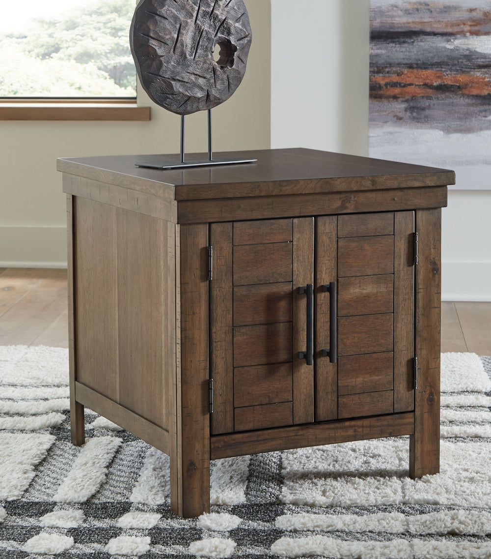 This end table might appear simple at first sight. But a closer look reveals beauty in the details. With plank-effect cabinet doors, a tobacco brown finish and antiqued bronze-tone hardware, itâ€™s simply beaming with charm. This side table-'s mix of cabi