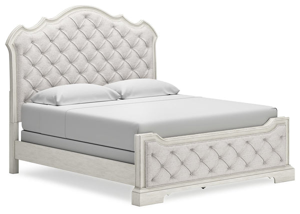 Add a touch of romance to your home with this California king upholstered bed. The antiqued white painted finish and serpentine-shaped silhouette details are the picture of easy elegance. Indulge your love of luxury with decadent button-tufted cushioning 