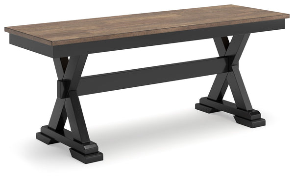 Raise the bar on modern farmhouse style with this dining bench. Its casual good looks are accentuated with a handsome two-tone finish. A sturdy silhouette adds a hearty element, whether your style is vintage, country or eclectic. This richly crafted seati