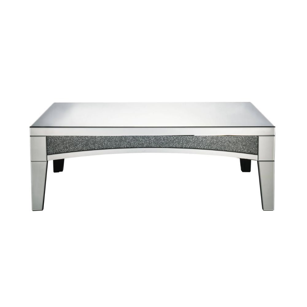 Brighten up your empty living room with the Nowles occasional table. This table offers a mirrored top and arched apron with faux stone inlay. The structure built from composite wood and mirrored panels covering every surface. A glam display table that nat