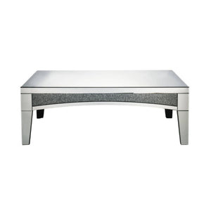 Brighten up your empty living room with the Nowles occasional table. This table offers a mirrored top and arched apron with faux stone inlay. The structure built from composite wood and mirrored panels covering every surface. A glam display table that nat