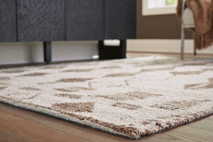  this area rug knows how to make a subtle statement. Its shades of beige and brown are a welcome complement underfoot that doesnâ€™t overtake your roomâ€™s decor. This beautiful rug infuses a laid-back sensibility that s
