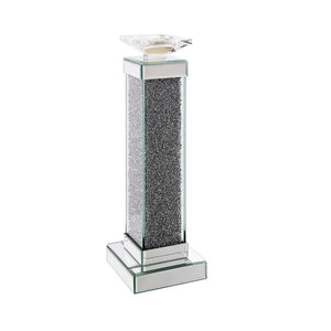 The Rekha candle holder collection fills your home with soothing scents and the simulating look of natural light. It is crafted from manufactured wood and features a mirrored frame with beveled edges and acrylic inlay. Available in two different sizes, ac
