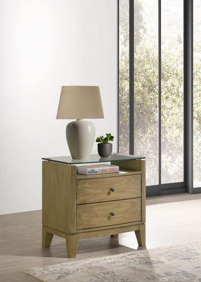 This nightstand is a perfect blend of style and functionality, featuring a natural pine finish that exudes a warm and inviting aura. Its top drawer offers cord management access, ideal for recharging devices conveniently. The piece-'s softly curved fronts