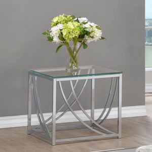  featuring a clear tempered glass top and a sleek metal frame finished in electroplated polished chrome. The gracefully curved metal accents enhance its contemporary style while add