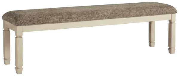 The beauty of this upholstered dining bench is something to savor. Serving up country cottage comfort and fresh farmhouse flair, the generously-scaled bench entices with a cushioned seat covered in a heavy woven fabric that complements the trendy textured