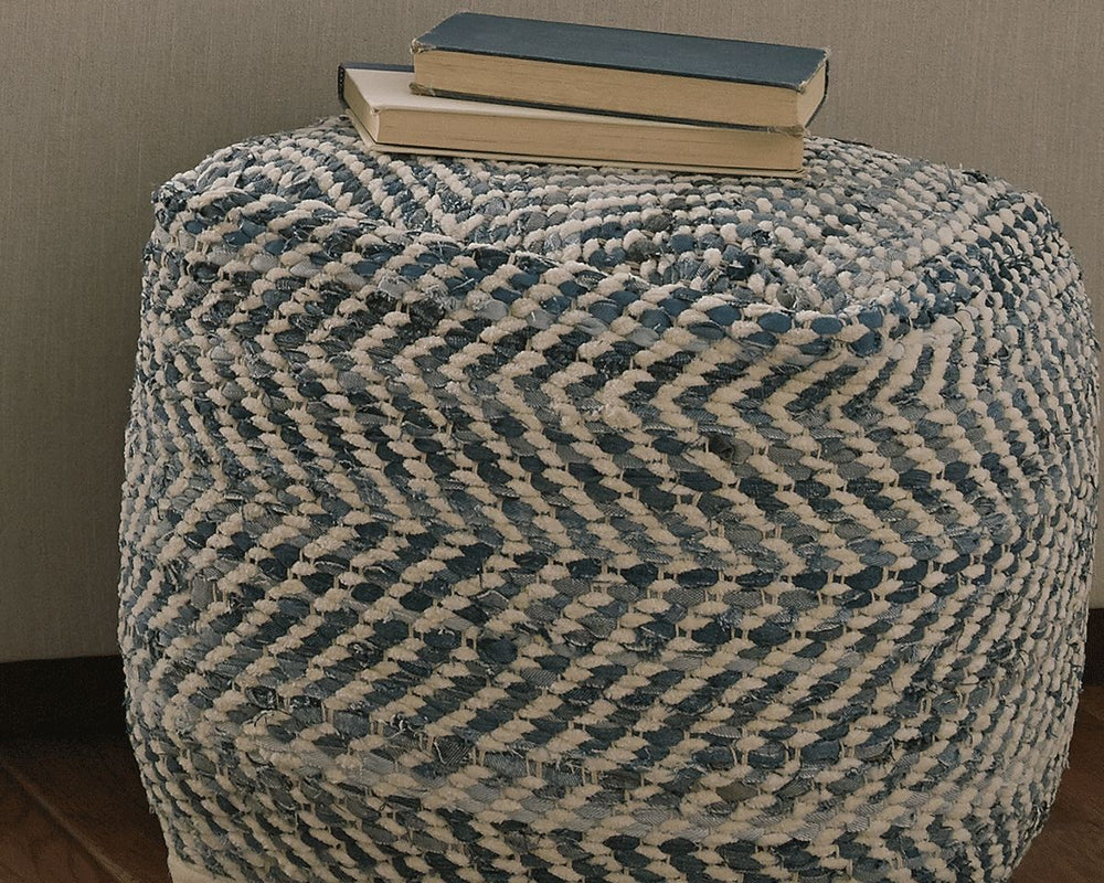 This darling pouf is queen of the blue jeans. Woven from strips of denim, the square shape will be a favorite go-to seat or ottoman. Itâ€™s also sturdy enough to hold a serving tray.<br/><br/><b>Product Features</b><ul><li>Handmade</li><li>Spot clean</li>