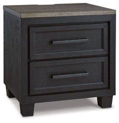 This nightstand is casual contemporary style simply done right. Its two-tone color scheme features a rich brushed black main color accented with a beautiful dusty grayish brown wood tone. Two drawers with sleek black pulls offer plenty of storage for your