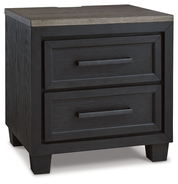 This nightstand is casual contemporary style simply done right. Its two-tone color scheme features a rich brushed black main color accented with a beautiful dusty grayish brown wood tone. Two drawers with sleek black pulls offer plenty of storage for your