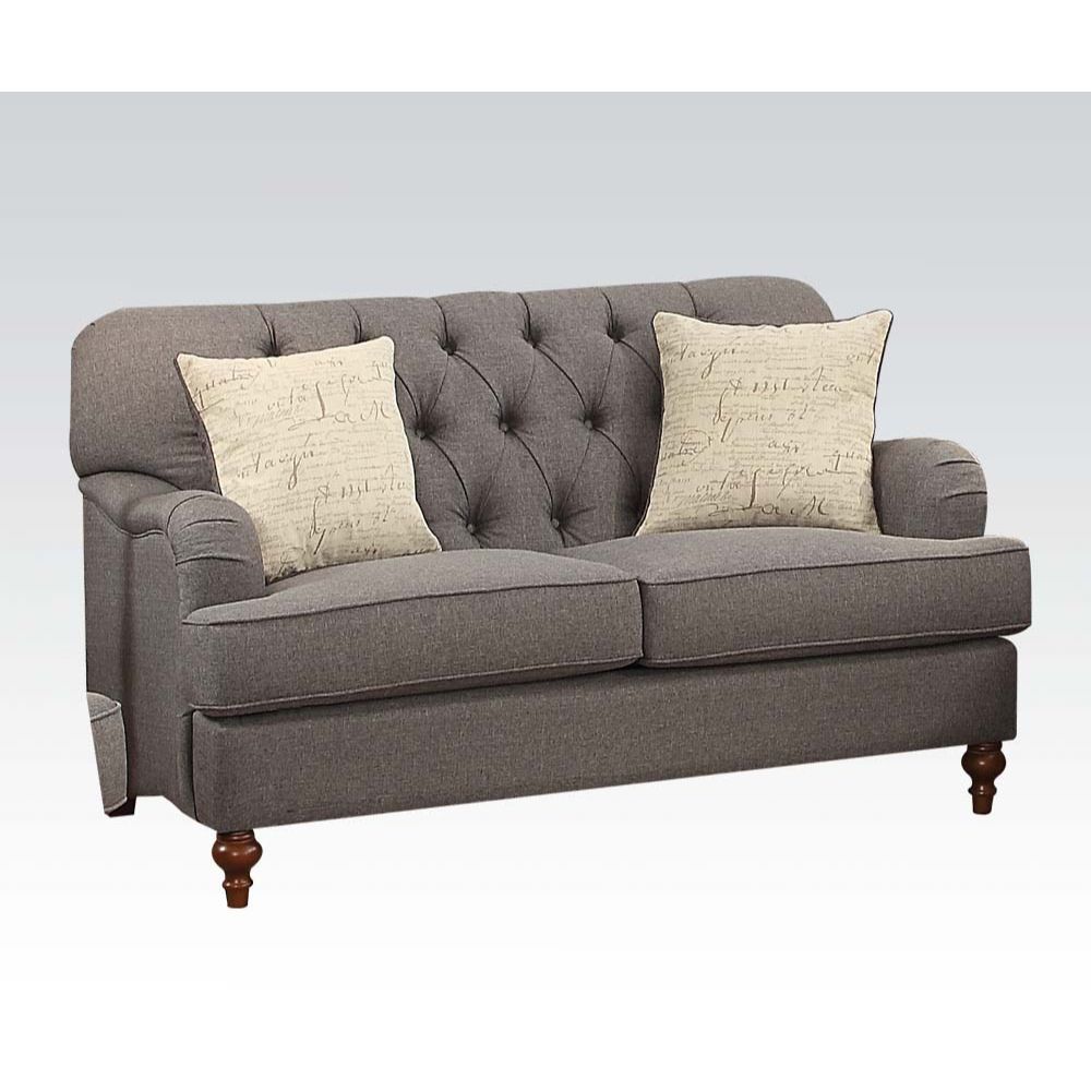 The Alianza loveseat is an ideal choice for any living room. This loveseat features a diamond tufted backrest, tight back and loose seat cushions. The dark gray fabric with brown wooden bun legs in the front and wooden legs , alongside the English curved 