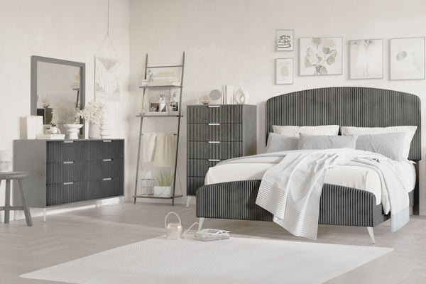 The Kailani 4 Piece Bedroom Set in Gray is a stunning fusion of modern elegance and luxurious comfort. This glamorous set includes an upholstered panel bed, a sleek dresser, a mirror, and a chest, all meticulously crafted to bring sophistication to your b