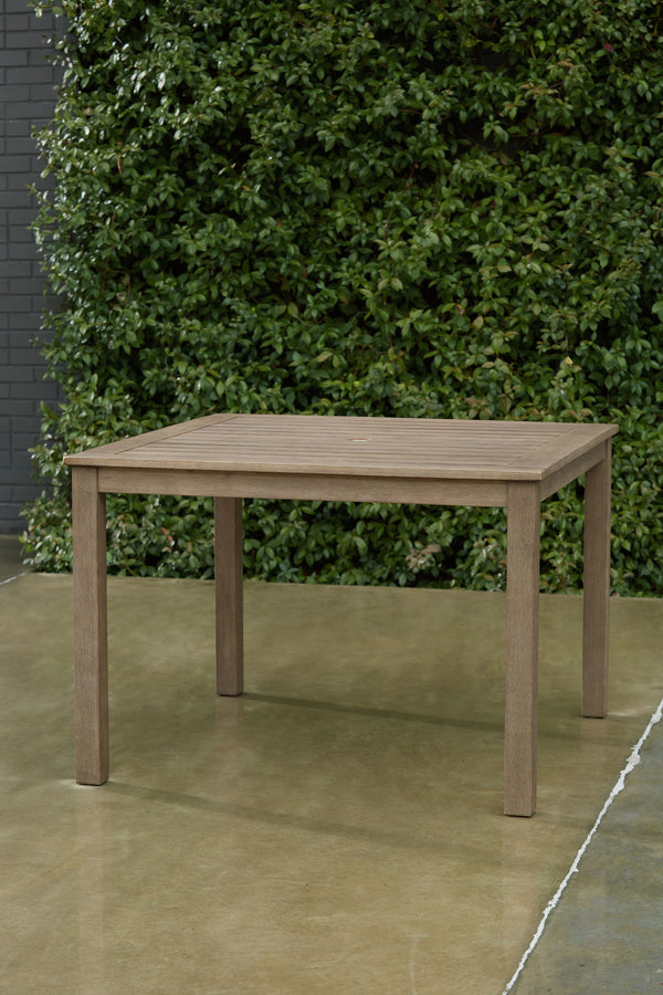 this dining table brings a casually cool feel to your outdoor space. The neutral brown hue of the piece easily pairs with your current porch or deck decor. An umbrella hole lets you decide whether to add an umbrella on sunny days.<br>