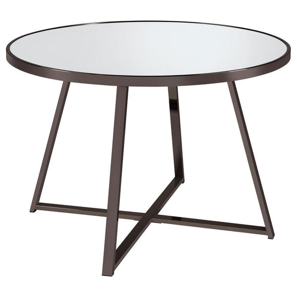 Gather for delicious meals with your favorite people in chic style with this contemporary dining table. The round table epitomizes modern minimalist design principles while adding decorative flair with subtle geometric touches in its angular, open frame s