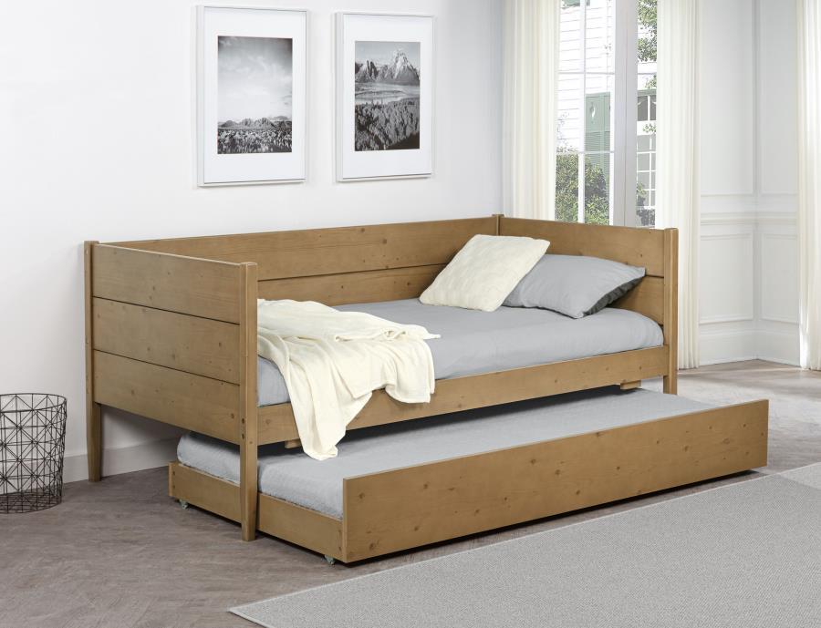 The transitional-style panel daybed with trundle features a natural brown finish that highlights its rustic charm and versatile appeal. Constructed from pine wood, plywood, MDF, and pine veneer, this piece combines durability with timeless design. The nat